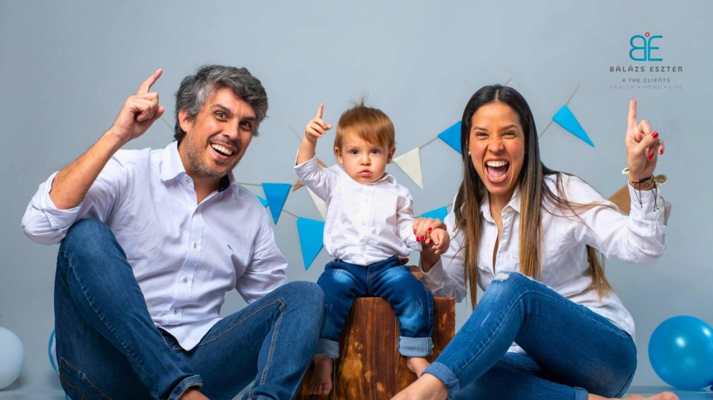 Happy young family in Hungary celebrating together — symbolising care, protection, and peace of mind through Immigration Health Insurance for Hungary.